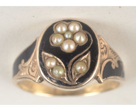 An early Victorian gold and black enamel mourning ring with a pearl set flowering plant, dated 1866, shaped ring box.  Condit