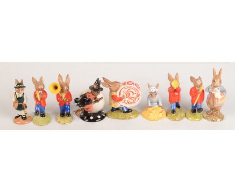 Eight Royal Doulton Bunnykins figures, comprising of the Oompah Band, 'Drummer DB26', 'The Drum-Major DB27', 'Sousaphone DB23