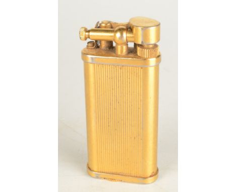 An English gold plated Dunhill Unique gas lighter no. 49447 maximum height 61mm boxed with booklet Condition report: Worn