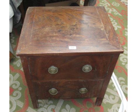 A mahogany commode, 19th century, with a cupboard door above a single drawer, height 66cm, width 58cm, depth 50cm.