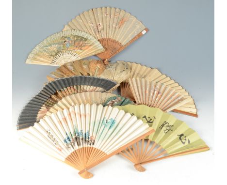 A Victorian mother of pearl handled feather fan, length 31cm, and nine other miscellaneous fans.