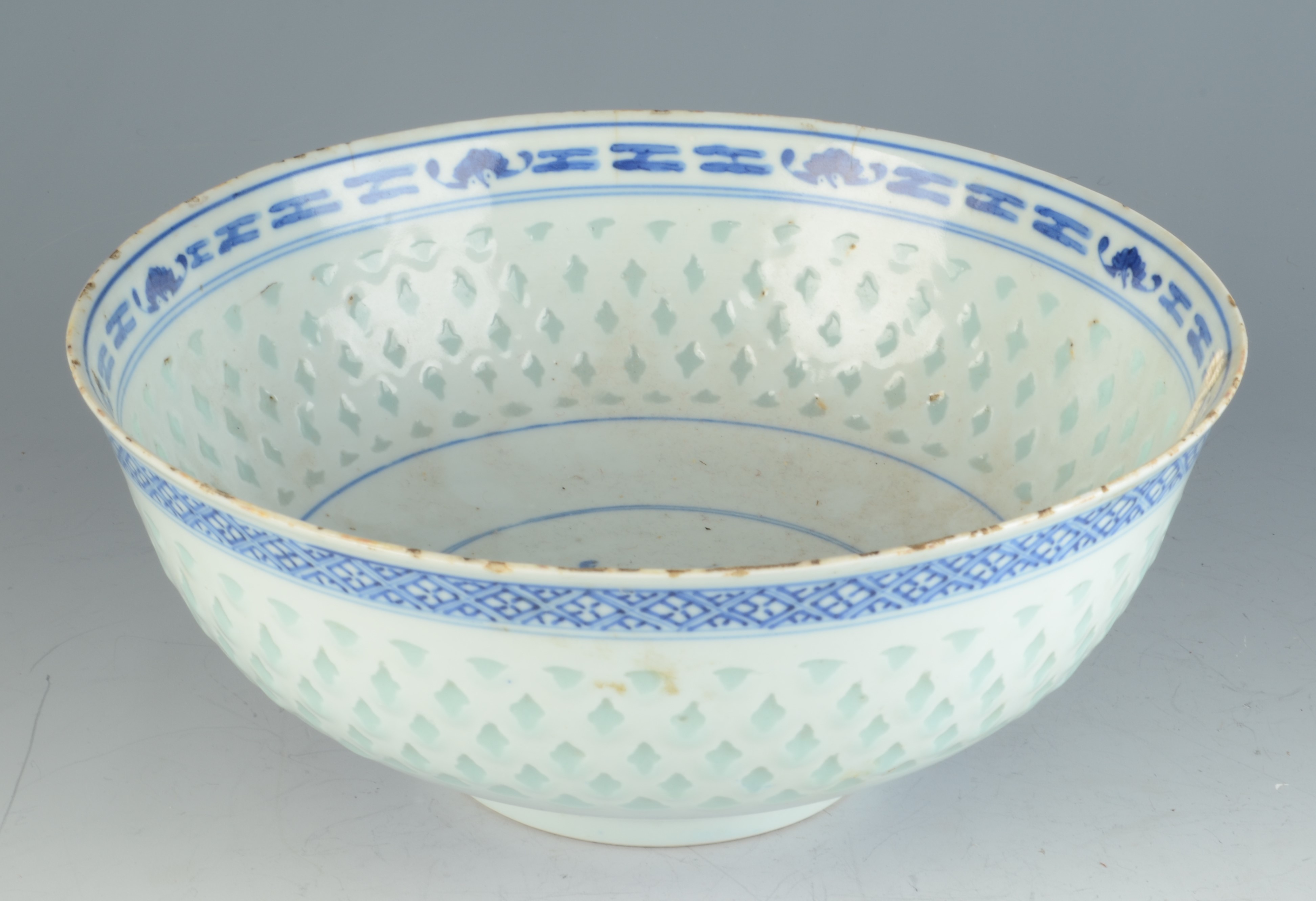 A Chinese porcelain blue and white rice grain bowl, 19th century, with