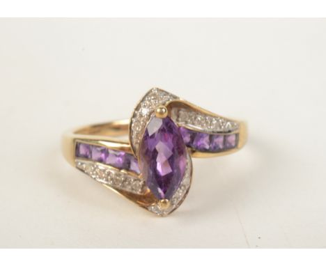 A 9ct gold diamond and amethyst ring. 