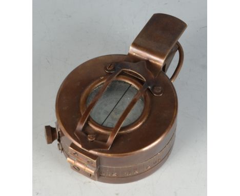 A military metal compass, inscribed T.G Ltd, London and dated 1940.
