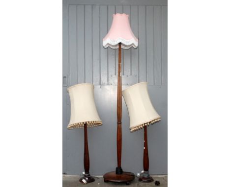 A mahogany standard lamp and two mahogany table lamps. 