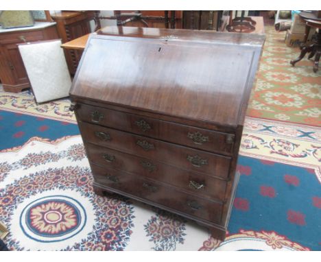 A walnut bureau, 18th century, the fall front opening to reveal a fitted interior above four long graduated drawers on bracke
