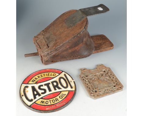A 1960s circular cast iron Castrol Motor Oil advertising sign, diameter 20cm together with one other iron panel cast with a g