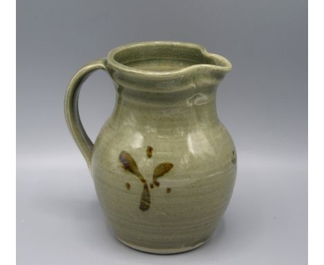 A Ray Finch Winchcombe Pottery jug, the green glaze decorated with brown abstract decoration, height 15.5cm.  