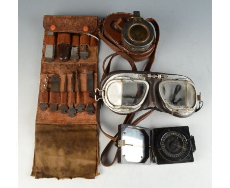 A metal compass by J.H. Steward, London in a brown leather case, diameter 6cm, a vellum boxed table tennis set, a leather pou