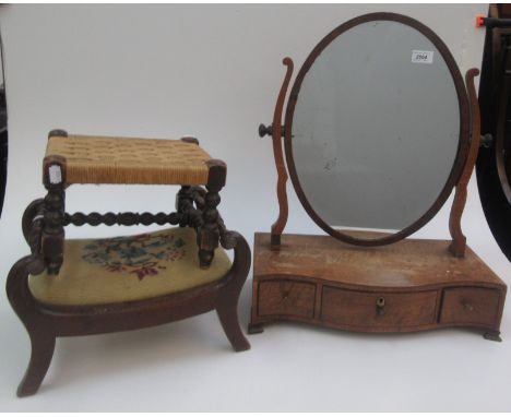 A George III mahogany toilet mirror, the oval plate on a serpentine base with three drawers on bracket feet, height 59cm, wid