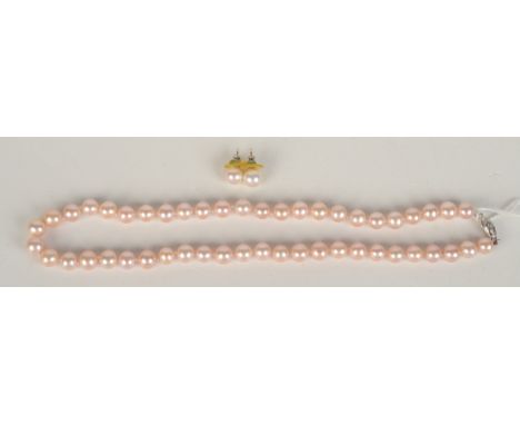 A cultured pink pearl necklace with white gold diamond set 14ct clasp, together with a pair of matching ear studs.
