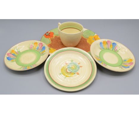 A Clarice Cliff Nasturtium Bizarre plate, painted with stylised flowers and with a Cafe au Laite brown stippled ground, diame