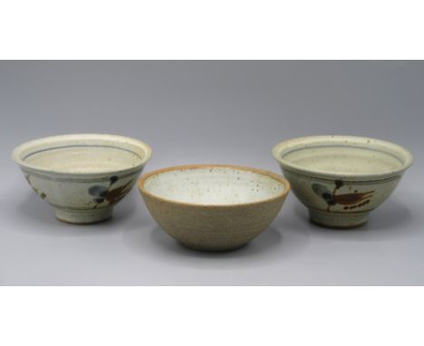 A pair of David Leach St Ives Studio Pottery bowls, with cream and brown mottled ground, diameter 14cm, and another bowl, dia
