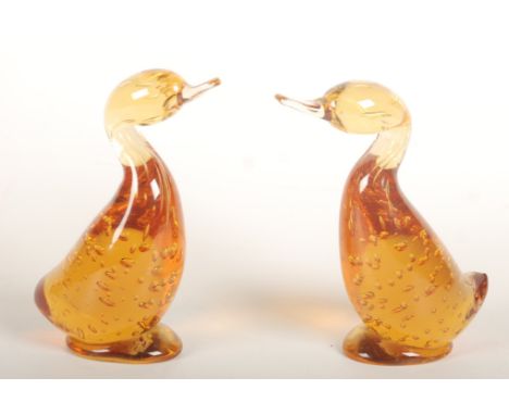 A pair of Whitefriars amber glass ducks, height 14.5cm. Condition report: Small fault on base area underneath tail but looks 