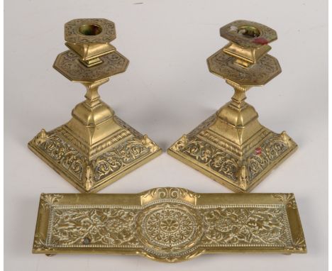 A pair of Aesthetic Movement brass candlesticks, each with Victorian diamond date impressed mark, worn, height 15cm, together