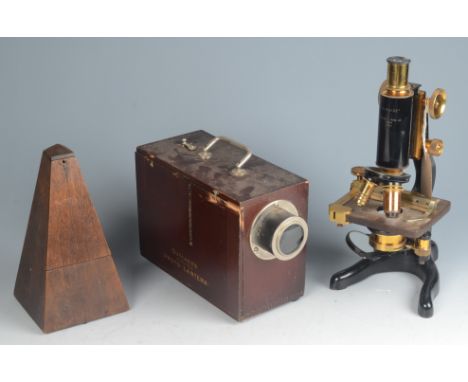 A brass and iron 'Service' microscope, by W. Watson &amp; Son Ltd, London, no 44721, height 32cm, a mahogany cased metronome,