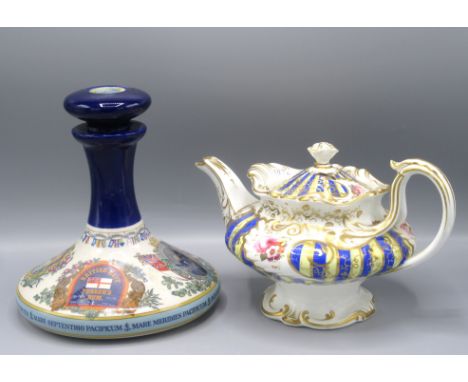A Wade porcelain British Navy Pusser's Rum decanter, height 22cm, diameter 20cm and a 19th century porcelain teapot, gilt dec