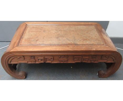 A Chinese hardwood Kang table, with a rectangular burr wood inset top, the frieze carved with a pair of vases flanking a jar 