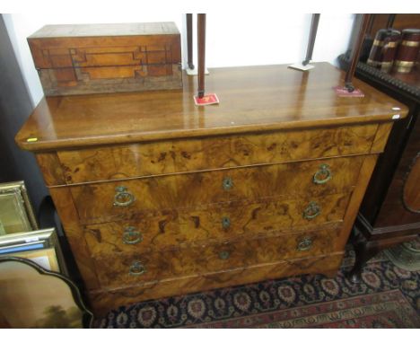 A continental figured walnut veneered 19th century chest of four long drawers above a plinth on bracket feet, height 93.5cm, 