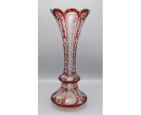 A Bohemian ruby flashed and gilt decorated glass vase, late 19th / early 20th century, with a flared rim, height 39.5cm.