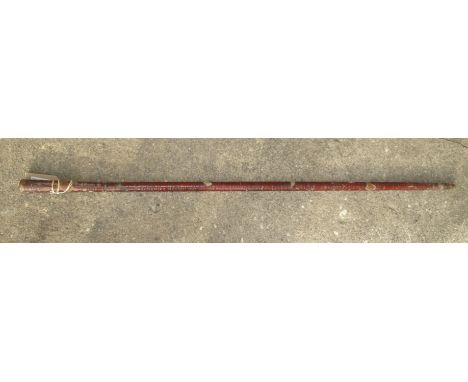 An eastern lacquered sword stick with button release, full length 91cm, blade length 42.5cm.