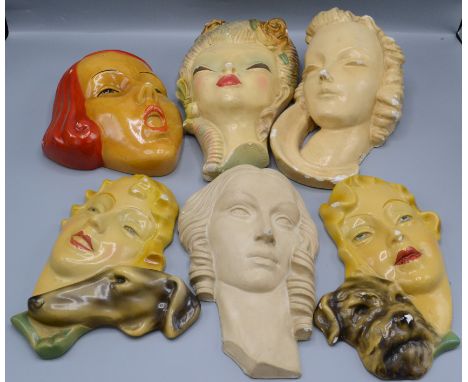 Six Art Deco style plaster wall masks, modelled as lady's, largest length 30.5cm. 