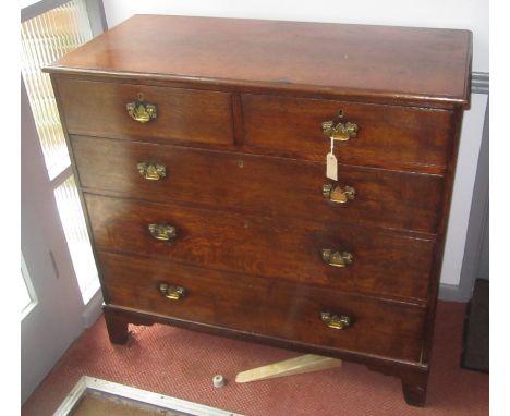 A George III oak chest of drawers, the rectangular moulded top above two short and three long drawers on bracket feet, height