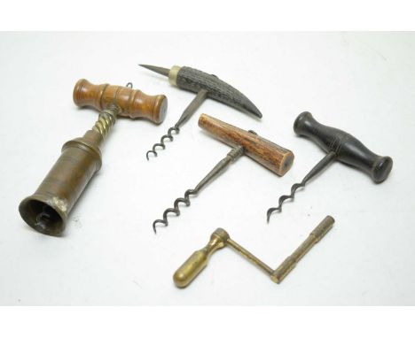 A collection of vintage corkscrews, including examples with turned wood, brass and other handles; together with a brass winde