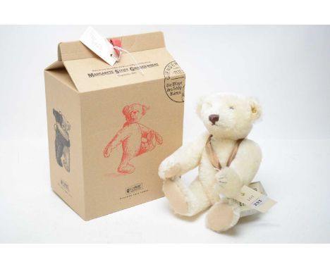 A Steiff anniversary white mohair teddy bear, commemorating the 150th anniversary of the birth of Margarete Steiff, button an