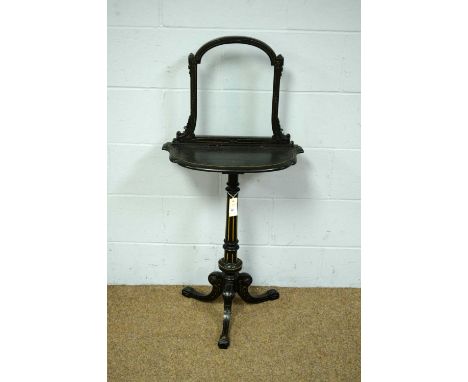 A Victorian gilt and ebonised occasional table/firescreen, with glazed panel above a ‘D’ shaped top, on fluted and turned col