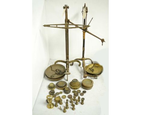 A set of black and gilt decorated brass postal scales, by W &amp; T Avery Ltd, Birmingham; together with another set of brass