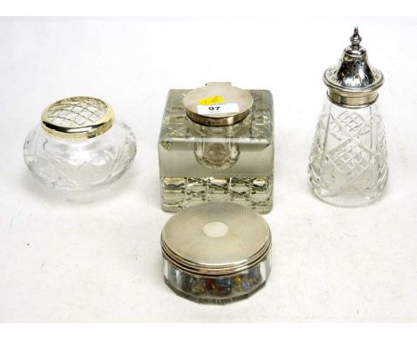 A silver mounted cut glass inkwell; a silver mounted cut glass sugar caster; and a silver mounted cut glass rouge pot; togeth