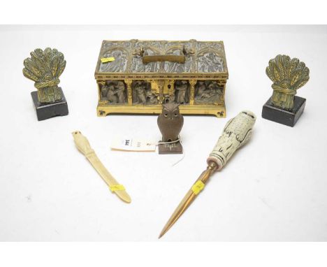 A selection of desk accessories, including: two novelty owl motif letter openers, one with brass blade; brass owl sculpture; 