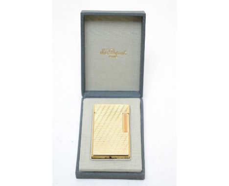 A Dupont gilt metal cigarette lighter, in original box.