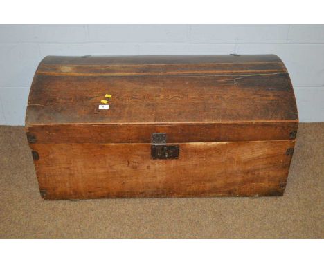 A 19th Century stained oak travel trunk, the domed hinged lid opening to reveal candle compartments, with twin handles, 99 x 