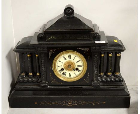 A 19th Century style German ebonised wood mantel clock, of architectural form, with H.A.C. 14 day strike, the case 39cms high