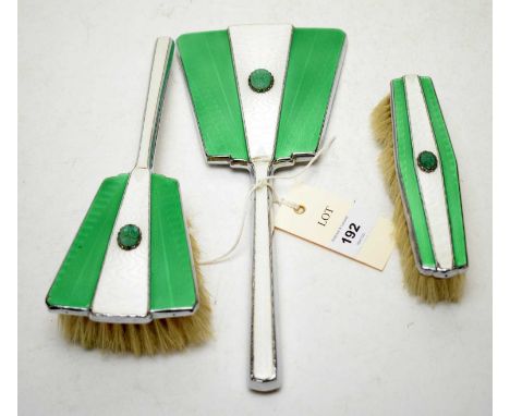 A white and green guilloche enamel silver plated three-piece dressing table set, comprising hair brush, clothes brush and han