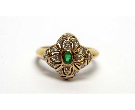 An emerald and diamond ring, of quatrefoil cluster form, on 14ct yellow gold shank, ring size K, 2.9g gross. 