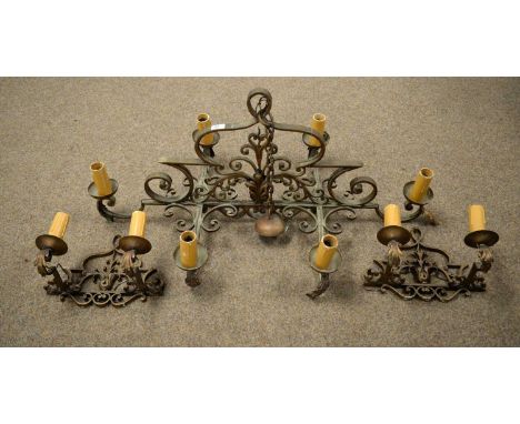 A 20th Century copper ceiling light, of scrolling design, with six branches, 98cms long; together with a pair of similar twin