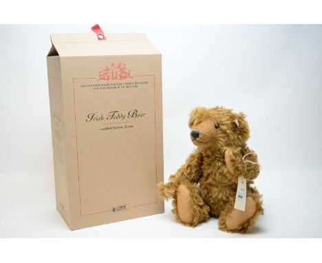 A Steiff limited edition Irish teddy bear, in reddish brown, with button and label to ear, in box.