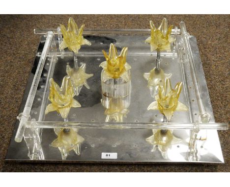 A contemporary mirrored glass light, fitted with five floral light fittings, over a mirrored square form base, 50 x 50cms.