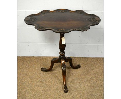 A Victorian-style carved mahogany tilt action tripod table, 73 x 52 x 73cms high.