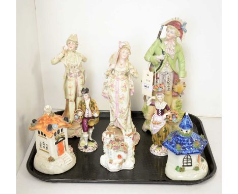 A pair of Derby figures of fruit sellers; together with a selection of Continental ceramic figures; and three Staffordshire a