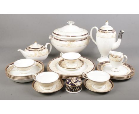 A quantity of Wedgwood Cornucopia tea/dinnerwares. Includes teapot, tureen, coffee pot, cups &amp; saucers, dinner plates, et