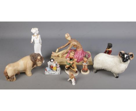 A quantity of ceramic figurines. Includes seated ballerina, Spode Eleanora, Ann &amp; John Farquharson bull, ceramic ram, Goe