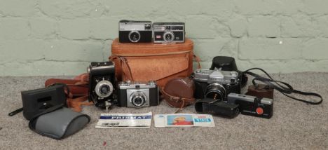 A quantity of cameras and camera equipment to include Kodak Brownie, Instamatic 300, Mamiya Prismat and Zeiss Icon Contina.  
