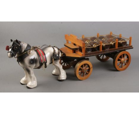 A ceramic shire horse with scratch built wooden cart.  