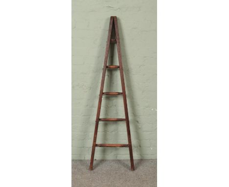 A five rung wooden A-Frame ladder, possibly for fruit picking. Height: 150cm.  