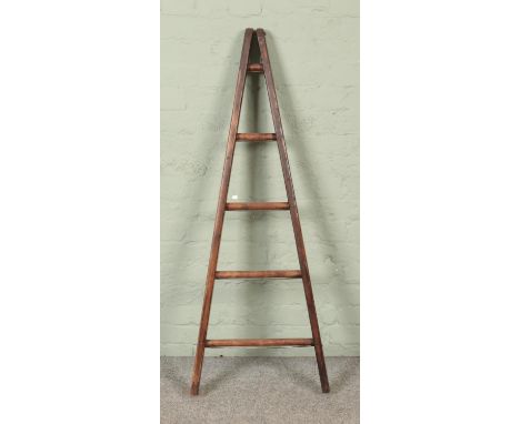 A five rung wooden A-Frame ladder, possibly for fruit picking. Height: 137cm.  