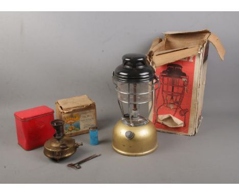 A boxed gold based Tilley Lamp along with boxed Primus No.96 L camping stove.  